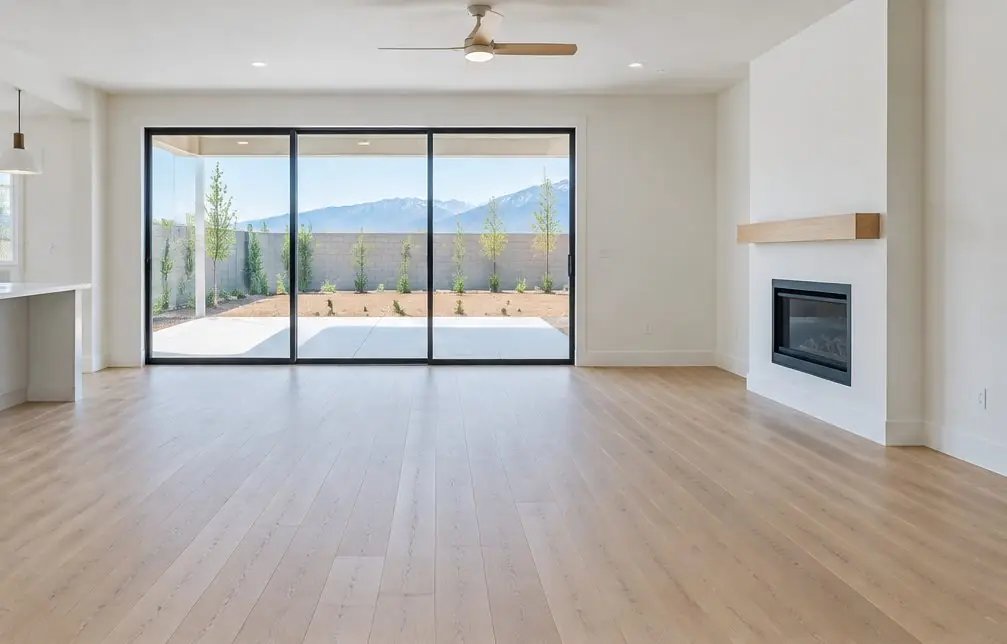 Illustration: a bright Ontario Ranch living room with a wide engineered oak plank floor laid over a concrete slab, a sliding glass door and a patio beyond