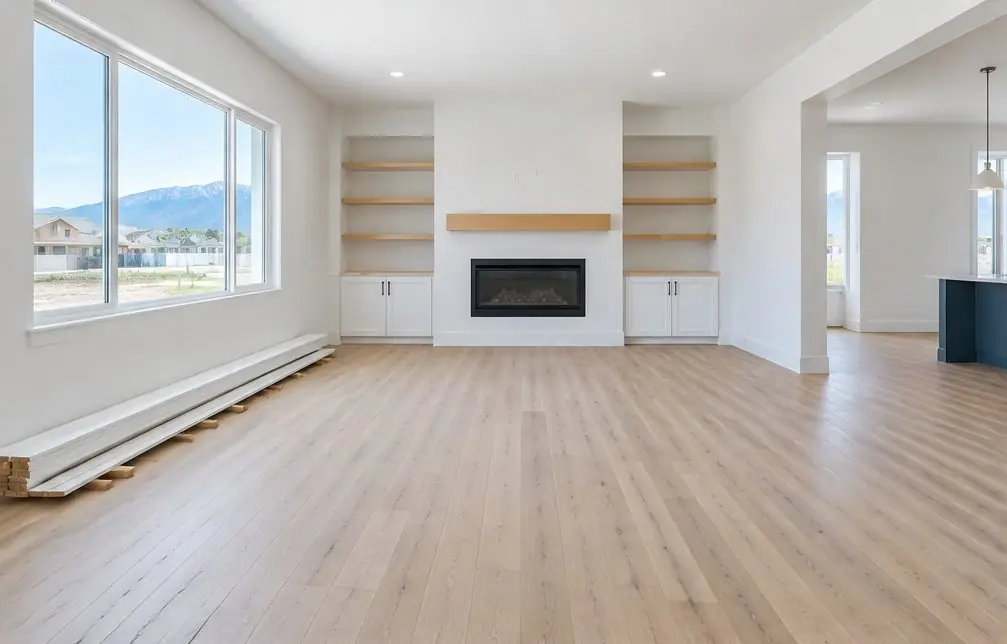 Illustration: a bright Ontario, CA living room with a freshly installed wide-plank oak floor, a window with afternoon light and baseboards leaning against the wall